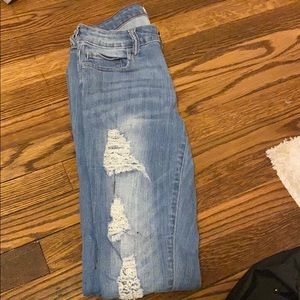 Light jeans with holes
